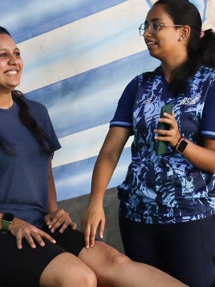 A physiotherapist uses a handheld dynamometer to objectively measure a client's quadriceps strength, demonstrating our commitment to data-backed, personalized rehabilitation.