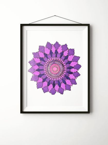 A digital mockup of a purple mandala art piece framed and hung on a wall, showing its potential as home decor.
