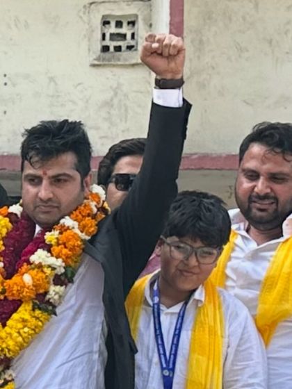 A victorious moment, celebrating with my supporters. Their belief in me is my motivation.