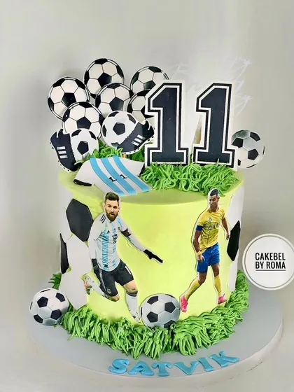 A football fan's dream cake, featuring star players Messi and Ronaldo. The cake is decorated with multiple footballs and edible grass for a stadium feel.