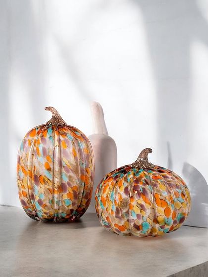 These handblown glass pumpkins, with their beautiful confetti-like mix of colors, are perfect for seasonal decor or as year-round artistic accents. Each one is unique in its pattern and shape.