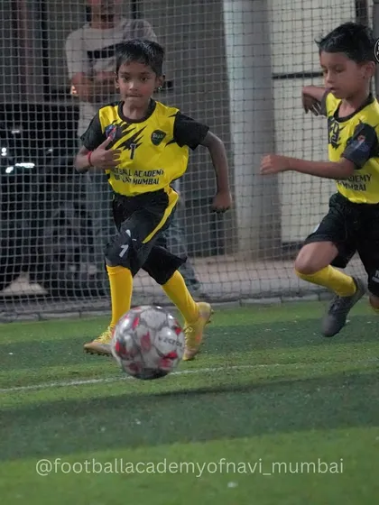 Two players race for a loose ball, showing the competitive edge honed in our training.