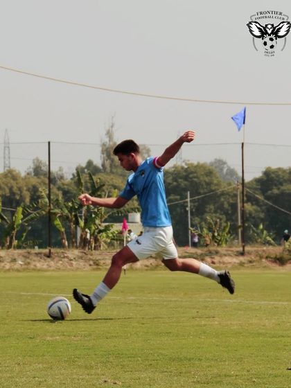 A player in mid-stride, connecting with the ball. This action shot captures the power and technique we drill into our players.