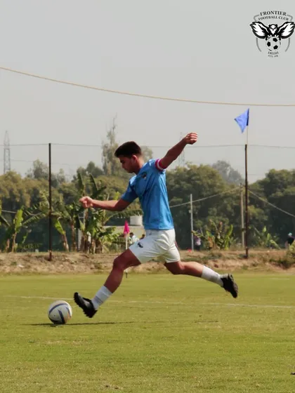 An action shot from a practice match, showing a player in full motion as he strikes the ball. This demonstrates the dynamic nature of our training.