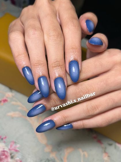 This aura nail set features a deep blue that radiates from the center. The gradient effect is subtle yet captivating, offering a modern and trendy look.