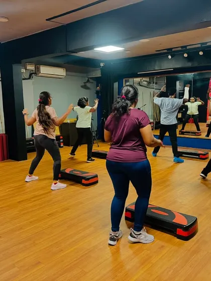 A look at our step aerobics class in action. We use these platforms for high-intensity cardio routines that are great for building stamina and toning your lower body.