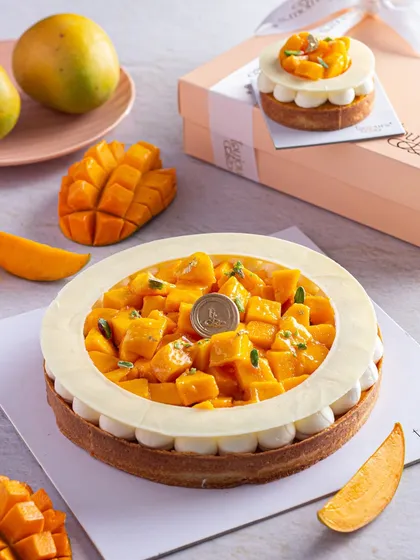 Our exquisite Mango Tart, filled with vanilla pastry cream and topped with a generous amount of fresh, diced Alphonso mangoes. The buttery shortcrust shell provides the perfect base for this seasonal star.
