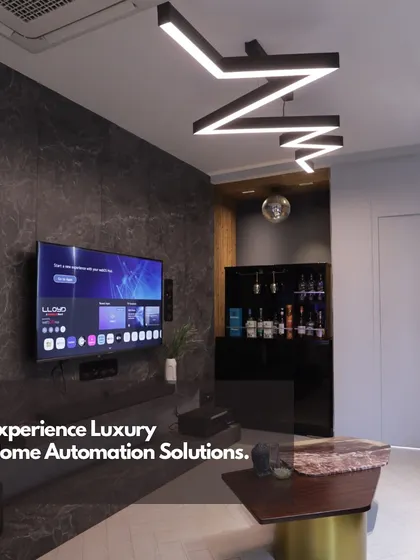 This image of a modern living room with integrated entertainment and lighting systems represents the final result of our detailed planning and installation work.