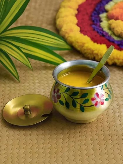 Our hand-painted brassware brings a touch of artistry to traditional items. This ghee pot, adorned with delicate floral motifs, is a beautiful and useful gift that your guests will love to display and use in their kitchens.