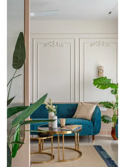 Peeking into the living room, this view frames the space with lush greenery, creating a sense of a hidden oasis. The composition highlights the careful placement of each design element.