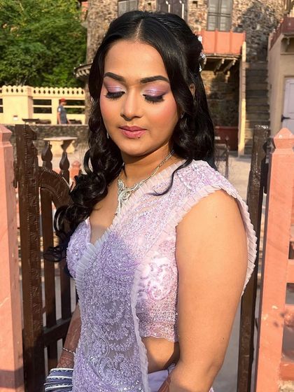 A closer look at this sundowner engagement look. The soft purple eyeshadow and natural-looking base create a dreamy and romantic vibe.