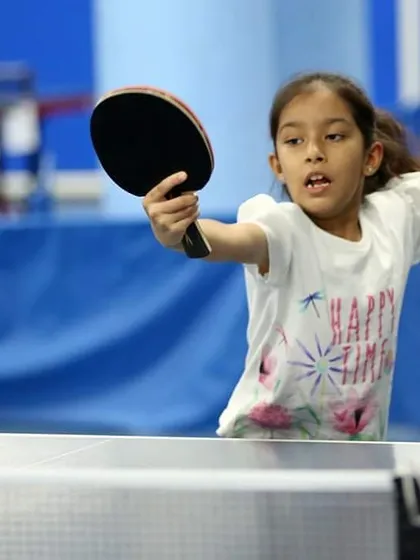Pranshi Anand is captured mid-swing, showing great form and determination. We encourage our players to be aggressive and confident in their shots.