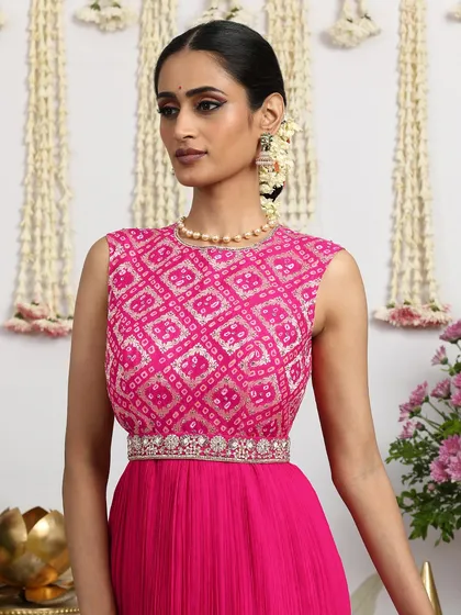 A close-up of the pink Bandhani bodice, showing the intricate embroidery and the flattering neckline.