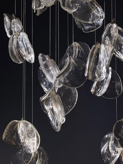 A detailed shot of a cluster of Bocci 141 pendants, their overlapping forms creating a rich and complex texture.