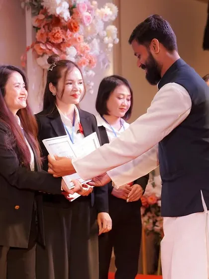 Congratulating another successful student. Each certified teacher becomes an ambassador of holistic health, carrying the lineage of this ancient science forward.
