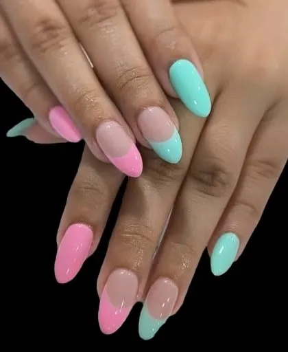 A fun, mismatched take on the French manicure. This design uses a different pastel color for each hand, with bright pink and aqua tips on long, almond-shaped nails.