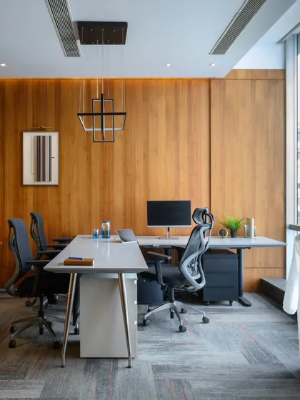 Warmth and sophistication were the goals for this executive cabin. I used rich wood paneling to create a cozy yet professional atmosphere. The clean lines of the desk and ergonomic chairs ensure it's a comfortable and productive space for long workdays.