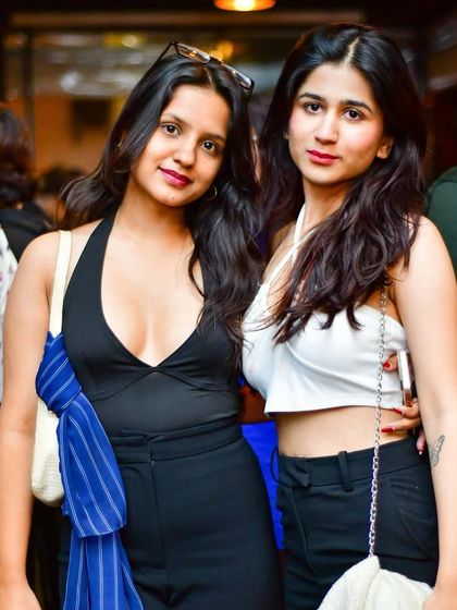 Two friends posing for a photo during our popular Ladies' Night event.