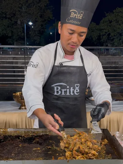 My chef focuses intently on preparing the Prawns Teppanyaki, a dish that combines fresh seafood with the exciting theatre of Japanese live grilling.