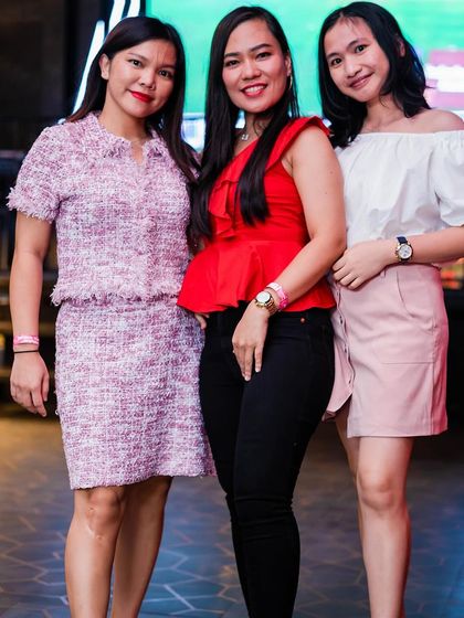 A group of elegantly dressed ladies.