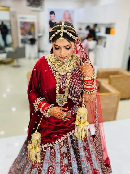 A beautiful candid moment of the bride. This photo captures her natural grace and the elegance of her bridal attire and makeup.