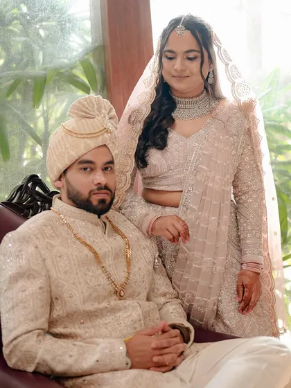 A regal portrait of the couple. The bride's soft and flowy hairstyle and glowing makeup create a romantic and timeless image.