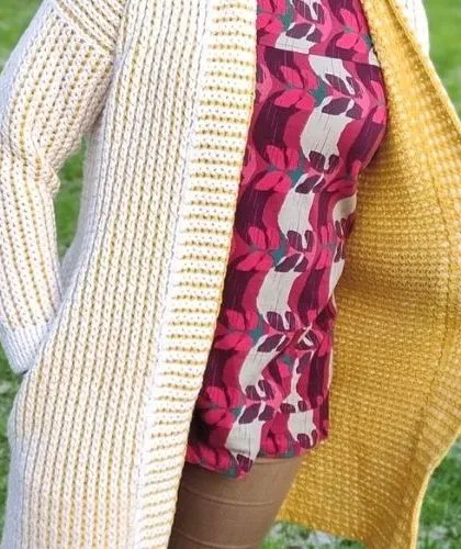 A beautiful, reversible crochet cardigan or shawl. This image highlights different colorwork techniques like mosaic, stripes, and tapestry that I can use to create unique wearable art.