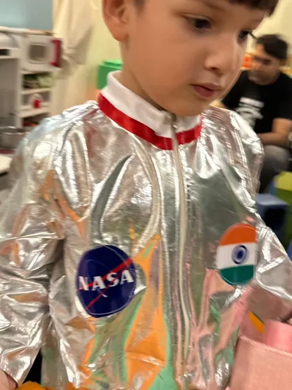 An astronaut exploring the party! This shiny NASA suit is perfect for an out-of-this-world celebration.