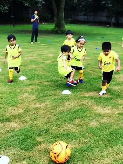 Our youngest players running through a cone drill. It's more than just training to win; it's about the journey of growth and the exhilaration of the game.