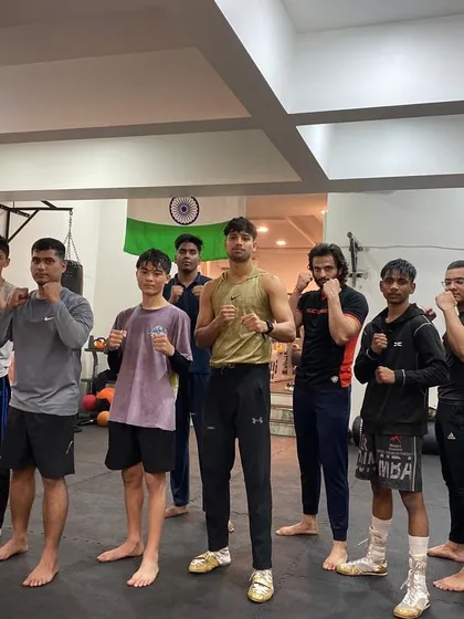 Our kickboxing class with their coach, ready to take on the next challenge.