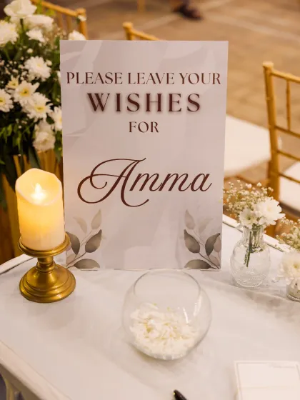 We love interactive details. A "Wishes for Amma" station invited guests to leave heartfelt messages, creating a beautiful keepsake for the birthday girl from her 79th celebration.