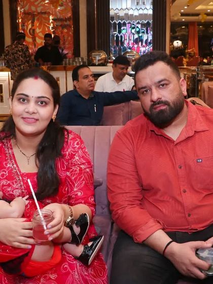 A candid shot of guests at an event, capturing the relaxed atmosphere of the celebration.