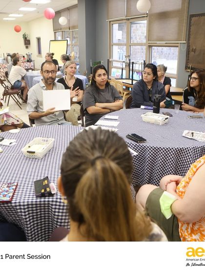 A lively discussion among parents at the Grade 1 workshop. These collaborative sessions strengthen our entire school community.