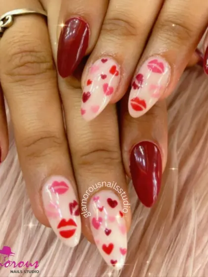 Sealed with a kiss. This romantic, Valentine's-themed set features a mix of deep red nails and accent nails covered in hand-painted hearts and lipstick kisses.