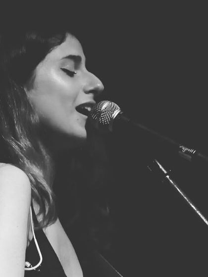 A close-up shot, lost in the song during a large-scale performance. These are the moments of pure connection.