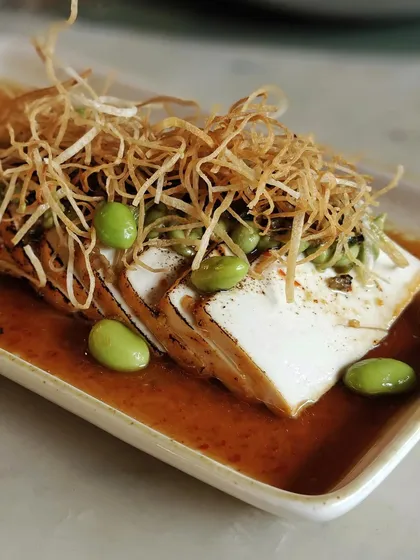 Our Tofu Carpaccio, a high-protein, low-carb option that doesn't compromise on flavor or texture.