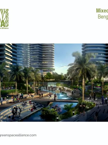 A vision for a mixed-use development in Bengaluru, featuring a central water channel with terraced seating and bridges. This design creates a dynamic public realm that encourages social interaction and seamlessly integrates residential and commercial activities.