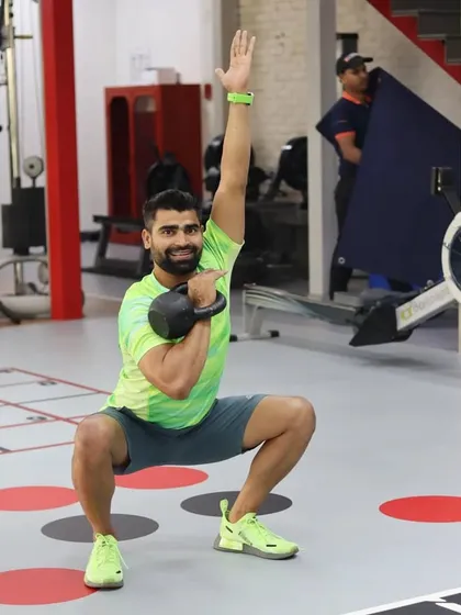 What seems impossible today will one day become your warm-up. This photo captures the joy of achieving a challenging lift like the kettlebell squat.