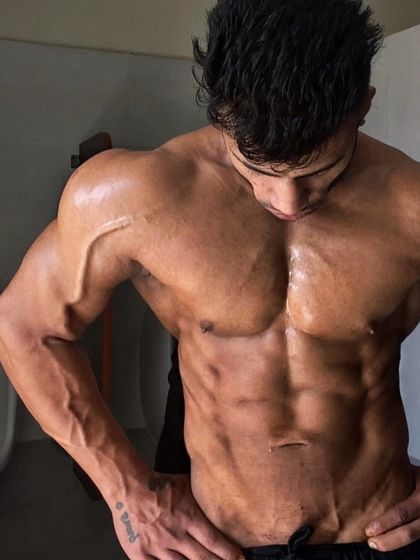 A front shot showcasing my vascularity and conditioning. This is a physique built on hard work and smart training, which I bring to all my clients.