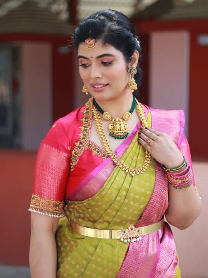 Dolled up for her son's naming ceremony, this client is wearing a classic look with an emphasis on radiant skin and eyes that sparkle, perfect for the happy occasion.