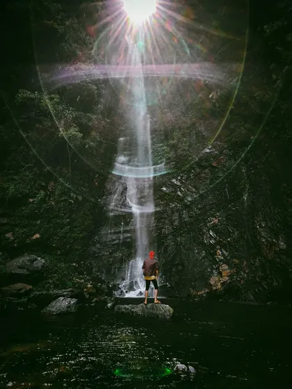 This magical shot of a waterfall, captured on an Oppo phone, uses a sun flare to create a dramatic, almost spiritual effect. It's an example of my ability to find and capture unique moments in nature.
