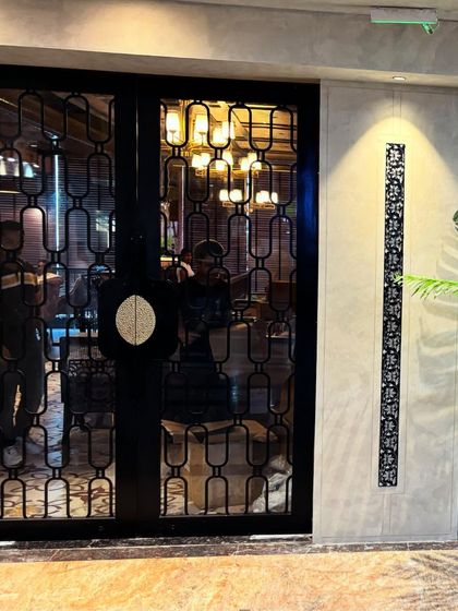 The entrance to our fine dining restaurant. We wanted to create a space that feels both modern and traditional, just like our food.