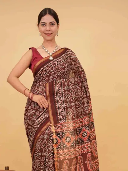 This maroon saree showcases a classic block-print pattern. As a ready-to-wear piece, it makes traditional designs accessible for everyday elegance or special occasions.