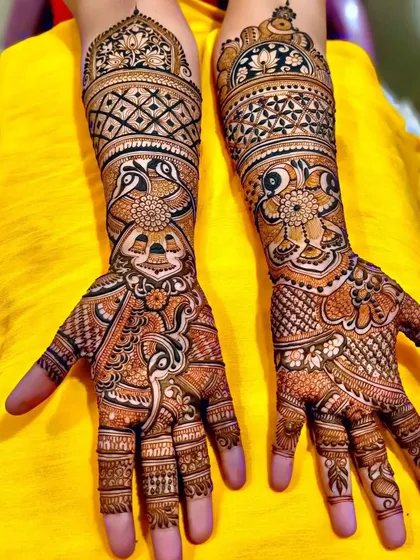 This design features a unique combination of peacock and elephant-head motifs, creating a very artistic look.
