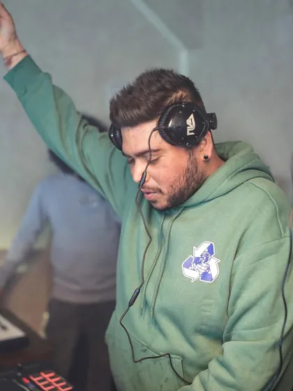 Arm raised, feeling the rhythm before I share it with the world.