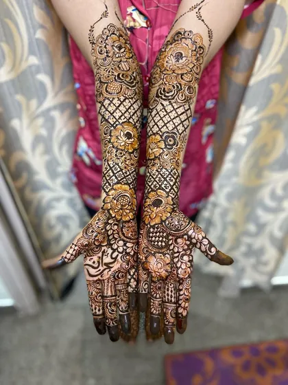 Another full bridal design with floral and geometric elements.