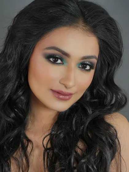 A dramatic teal and black smokey eye. This look is perfect for fashion editorials or the runway, showcasing skills you'll learn in my advanced classes.