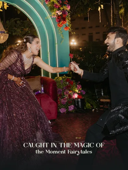 Caught in the magic of the moment. A playful and romantic interaction between the couple during their fairytale Sangeet.