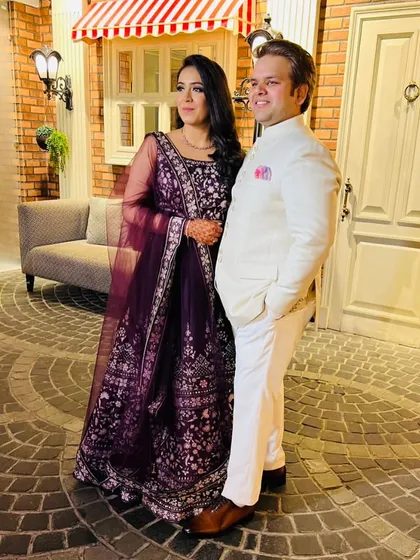 Here I am with my brother and co-founder, Nikhil. I'm wearing a classic, all-white custom Jodhpuri suit, a perfect example of how we blend traditional silhouettes with clean, modern tailoring for a sophisticated finish.