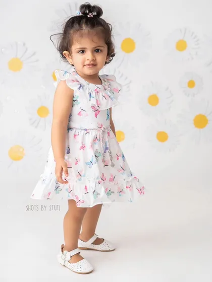 This little pro poser is ready for her close-up. Even at a young age, we can capture beautiful portraits that showcase your child's budding personality.